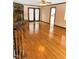 Open living room with hardwood floors, stone fireplace, and natural light at 466 Oren Gaines Rd, Goldston, NC 27252