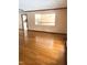 Spacious living room showcasing gleaming hardwood floors and a bright, open layout at 466 Oren Gaines Rd, Goldston, NC 27252