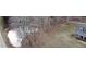 A serene pond sits near the home, amidst mature trees, enhancing the property's natural beauty at 466 Oren Gaines Rd, Goldston, NC 27252