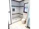 Bathroom with a tile shower featuring glass accents and a tiled floor at 466 Oren Gaines Rd, Goldston, NC 27252