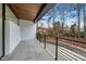Concrete outdoor balcony with black metal railings, wood ceiling, and views of the nearby properties at 4908 Birchleaf Dr, Raleigh, NC 27606