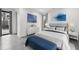 Well-lit bedroom with calming blue accents and a comfortable bed at 4908 Birchleaf Dr, Raleigh, NC 27606