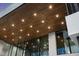 Detailed view of the stained wood exterior soffit, beautifully lit with recessed lighting fixtures at 4908 Birchleaf Dr, Raleigh, NC 27606