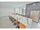 Bright kitchen boasts a spacious island with sleek gray cabinets and a stainless steel refrigerator at 4908 Birchleaf Dr, Raleigh, NC 27606