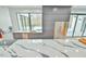 Bright kitchen with an island sink area overlooks the pool and backyard at 4908 Birchleaf Dr, Raleigh, NC 27606