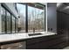 Kitchen sink with a picture window offering panoramic views of the wooded backyard at 4908 Birchleaf Dr, Raleigh, NC 27606