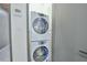 Laundry room with stacked washer and dryer at 4908 Birchleaf Dr, Raleigh, NC 27606