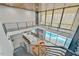 Aerial view showcasing the open-concept living area, kitchen, and pool, filled with natural light from large windows at 4908 Birchleaf Dr, Raleigh, NC 27606