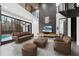 Spacious living room with high ceilings and a view of the pool through large windows at 4908 Birchleaf Dr, Raleigh, NC 27606