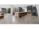 Spacious open concept living area features modern kitchen with island, living room, and staircase at 4908 Birchleaf Dr, Raleigh, NC 27606