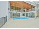 A modern home featuring a backyard pool, large glass windows, and an inviting outdoor entertainment space at 4908 Birchleaf Dr, Raleigh, NC 27606