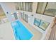An aerial view showcases a modern pool, seamlessly integrated with the home's design and luxurious features at 4908 Birchleaf Dr, Raleigh, NC 27606