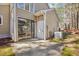 Backyard exterior featuring a patio, sliding glass door, and utility access at 5017 Pine Cone Dr, Durham, NC 27707