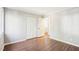 Bedroom with white closet doors and luxury vinyl plank flooring at 5017 Pine Cone Dr, Durham, NC 27707