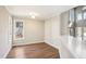Bright dining area featuring wood floors and light gray walls and trim at 5017 Pine Cone Dr, Durham, NC 27707