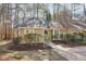 Single-story home featuring a landscaped front yard with mature trees at 5017 Pine Cone Dr, Durham, NC 27707
