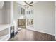 Open living room with a modern fireplace, and large windows for an abundance of natural light at 5017 Pine Cone Dr, Durham, NC 27707
