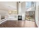 Bright living room featuring a fireplace and a sliding glass door at 5017 Pine Cone Dr, Durham, NC 27707