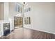 Bright living room featuring large windows, a sliding glass door, and a modern fireplace at 5017 Pine Cone Dr, Durham, NC 27707