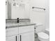 Bathroom featuring granite countertop, white vanity, and modern fixtures at 603 Lee St, Burlington, NC 27217