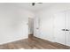 Bright bedroom with wood-look flooring, ceiling fan, and double door closet at 603 Lee St, Burlington, NC 27217