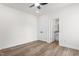 Bedroom with ceiling fan, wood-look flooring, and ensuite bathroom at 603 Lee St, Burlington, NC 27217