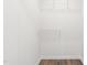 Walk-in closet with built-in shelving and wood-look flooring at 603 Lee St, Burlington, NC 27217