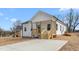 Charming home exterior with freshly painted siding and a quaint, inviting front porch and new landscaping at 603 Lee St, Burlington, NC 27217