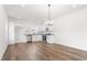 Well-lit kitchen featuring modern appliances, granite countertops, and a dining area at 603 Lee St, Burlington, NC 27217