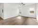 Spacious room featuring hardwood floors, large windows for ample natural light, and fresh paint at 603 Lee St, Burlington, NC 27217
