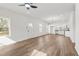 Spacious open-concept room featuring hardwood floors connecting the kitchen, dining, and living areas at 603 Lee St, Burlington, NC 27217