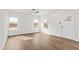 Bright and airy living room featuring wood floors, a large window for ample natural light, and fresh paint at 603 Lee St, Burlington, NC 27217