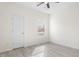 This bedroom features gray wood-look flooring and a ceiling fan at 605 Lee St, Burlington, NC 27215
