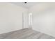 This bedroom features an open doorway and neutral color palette at 605 Lee St, Burlington, NC 27215