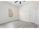 Comfortable bedroom features a bright window, and neutral flooring at 605 Lee St, Burlington, NC 27215