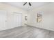 Bright bedroom with a ceiling fan, closet, stylish flooring, and a bathroom entrance at 605 Lee St, Burlington, NC 27215