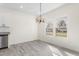 Bright dining area with modern lighting and large windows offering great views at 605 Lee St, Burlington, NC 27215