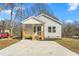 Charming exterior view of the home with a well-maintained yard and driveway at 605 Lee St, Burlington, NC 27215