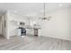 Well-lit kitchen features stainless steel appliances, granite countertops, and modern lighting at 605 Lee St, Burlington, NC 27215