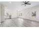 Bright living space with white walls, hardwood floors, modern fixtures, and plenty of natural light at 605 Lee St, Burlington, NC 27215