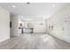 Spacious living area with updated kitchen, modern lighting, and an open floor plan at 605 Lee St, Burlington, NC 27215