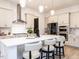 Modern kitchen with a large center island, stainless steel appliances, and stylish pendant lighting at 696 The Parks Dr, Pittsboro, NC 27312