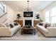 Inviting living room with a fireplace, neutral decor, and plenty of natural light at 696 The Parks Dr, Pittsboro, NC 27312