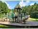 Community playground featuring slides and climbing structures for children in a safe, sandy environment at 696 The Parks Dr, Pittsboro, NC 27312