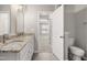 Bathroom featuring granite countertops, toilet, and doorway to another room at 711 Keystone Park Dr # 51, Morrisville, NC 27560