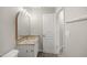 Bathroom featuring single vanity with granite countertops, toilet, and decorative mirror at 711 Keystone Park Dr # 51, Morrisville, NC 27560