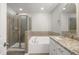 Bright bathroom featuring a shower, soaking tub, and granite countertops at 711 Keystone Park Dr # 51, Morrisville, NC 27560