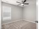 Bedroom featuring neutral carpet, gray paint, ceiling fan, and a window at 711 Keystone Park Dr # 51, Morrisville, NC 27560