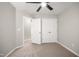 Neutral bedroom features a ceiling fan, closet, and leads into an en-suite bathroom at 711 Keystone Park Dr # 51, Morrisville, NC 27560