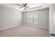 Serene bedroom with a ceiling fan and large window, offering a comfortable and relaxing retreat at 711 Keystone Park Dr # 51, Morrisville, NC 27560
